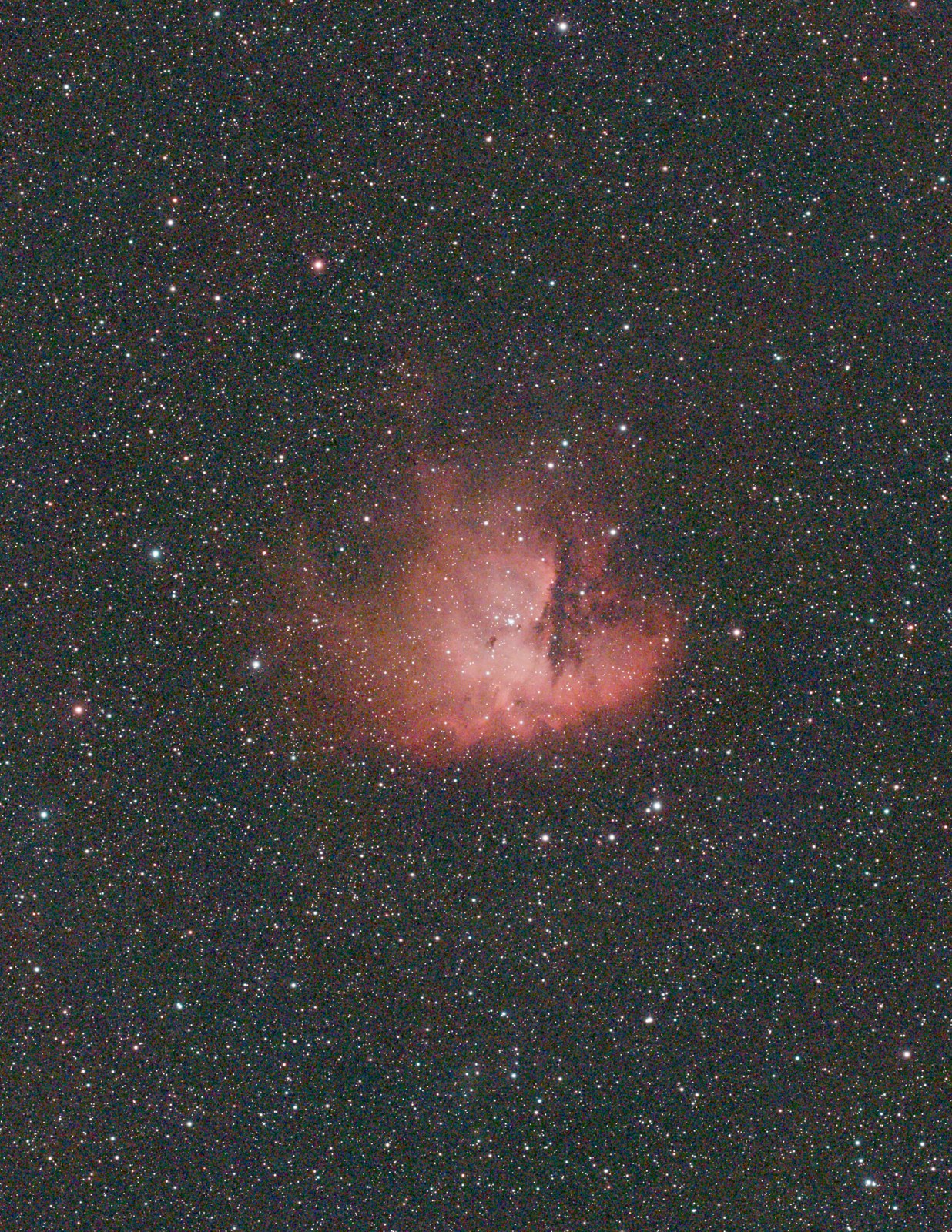 A stretched nebula with a raised, milky black point